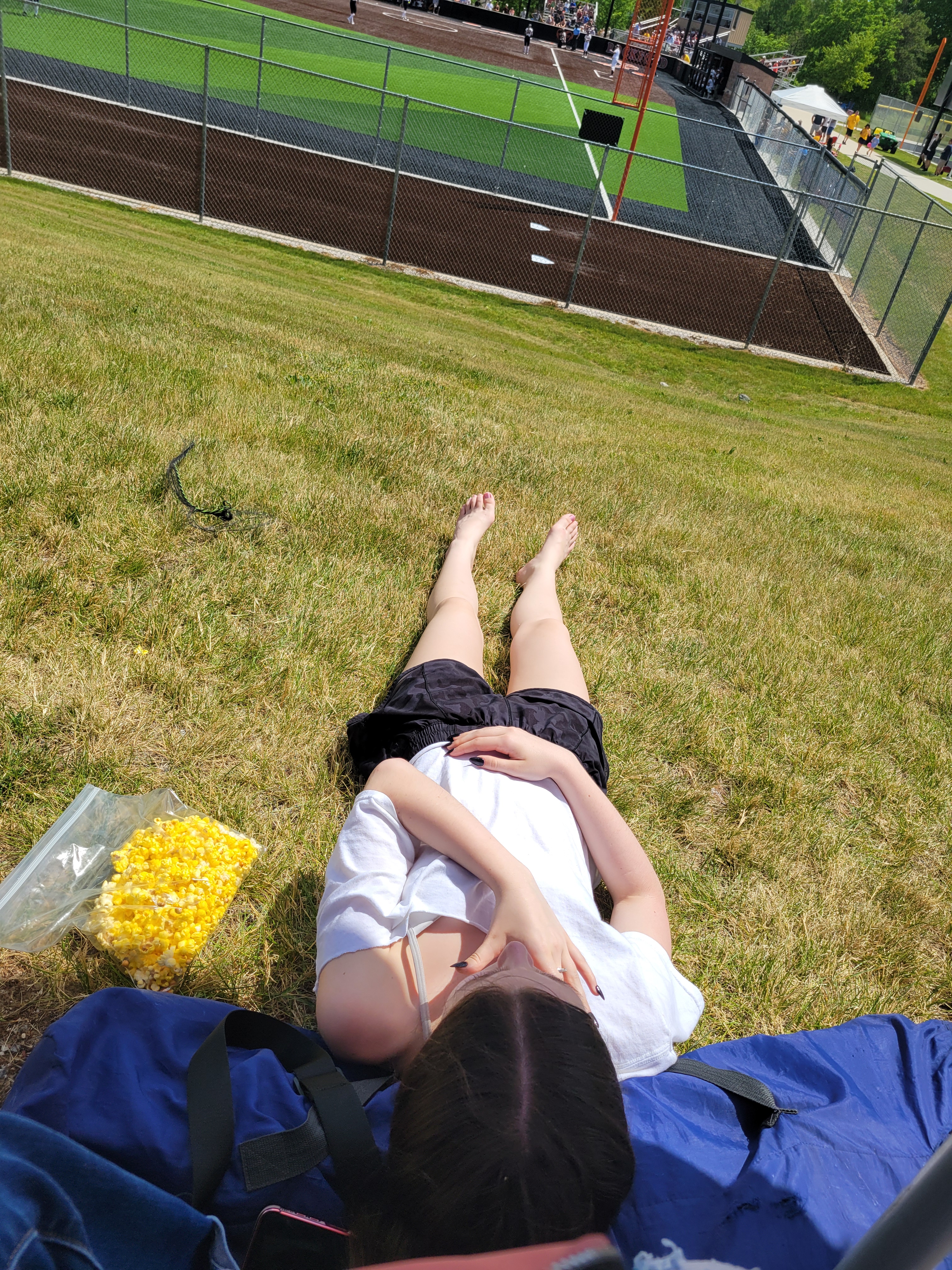 A soaking up the sun at one of K's play off games. 